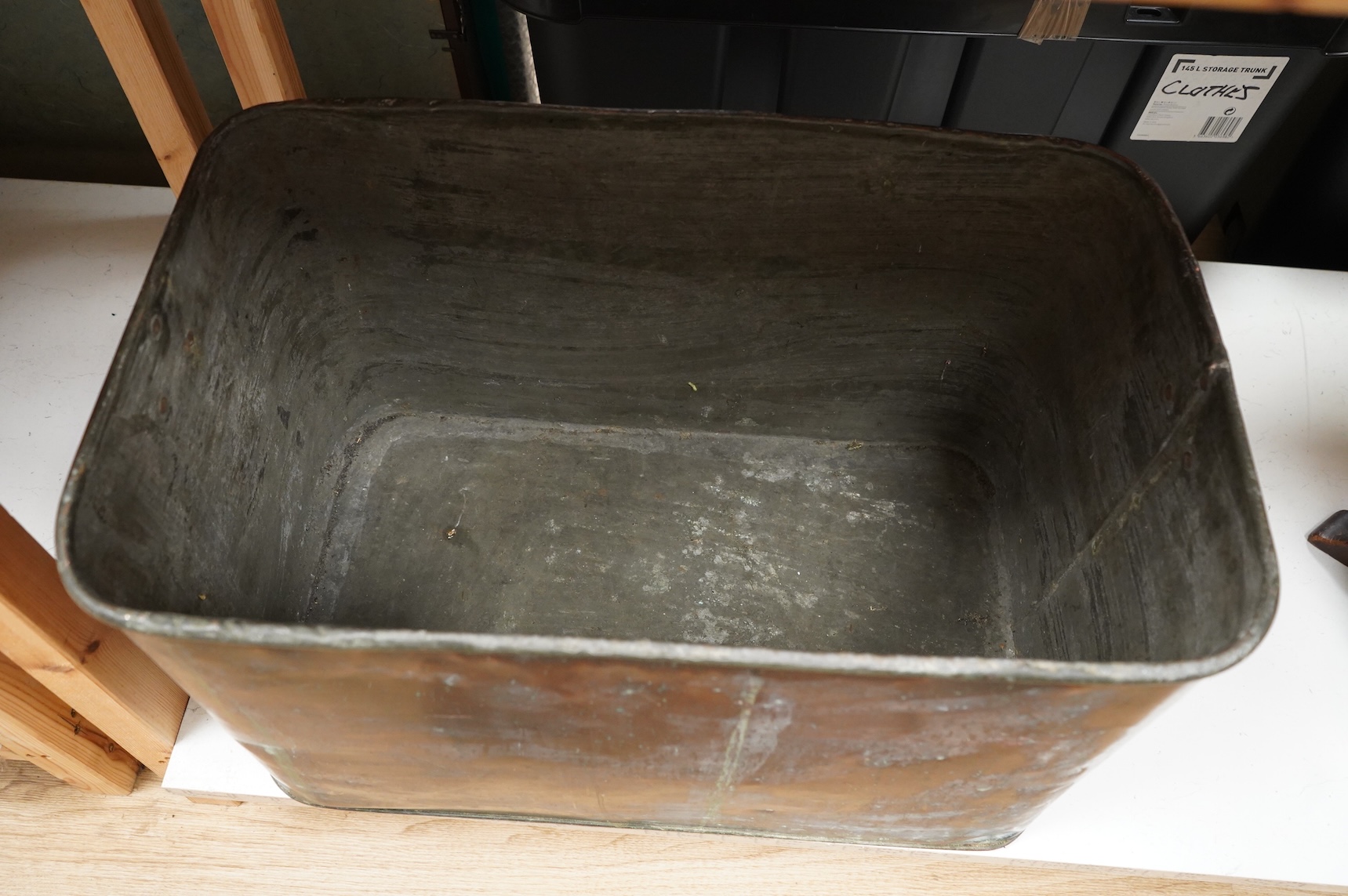 A large rectangular copper flour bin and cover, 60cm wide x 38 cm deep x 46cm high.